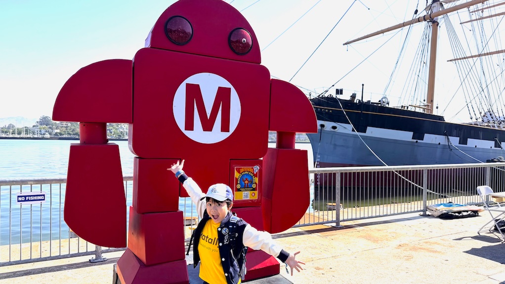 Kanata beside the robot monument at Maker Faire Bay Area