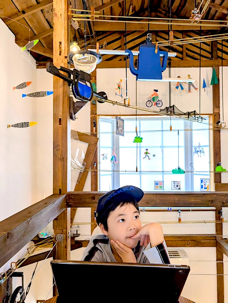 Kid creator Kanata at his workbench